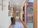 Inviting hallway with wood accents, decorative artwork, and a view of a cozy living space at 3009 Pleasant Hill Church Rd, Siler City, NC 27344