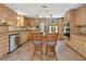 Kitchen features stainless steel appliances, wooden cabinetry, tile floors, and a kitchen island with seating at 3009 Pleasant Hill Church Rd, Siler City, NC 27344
