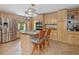 Eat-in kitchen featuring stainless steel appliances, tile floors, and an island with bar stool seating at 3009 Pleasant Hill Church Rd, Siler City, NC 27344