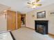 Cozy living area featuring fireplace, neutral walls, ceiling fan and views to another room at 3009 Pleasant Hill Church Rd, Siler City, NC 27344