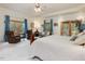 Spacious bedroom features seating area, ceiling fan, and access to a private balcony at 3009 Pleasant Hill Church Rd, Siler City, NC 27344