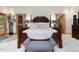Spacious main bedroom with wooden furniture, soft lighting, and access to outdoor deck at 3009 Pleasant Hill Church Rd, Siler City, NC 27344