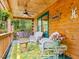 Relaxing porch with seating, a ceiling fan, and views of the surrounding trees at 3009 Pleasant Hill Church Rd, Siler City, NC 27344