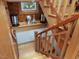 Elegant stairway with wood railings and charming decor, stained glass window on landing at 3009 Pleasant Hill Church Rd, Siler City, NC 27344