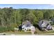 Aerial view of a home with a backyard pool, lush greenery, and neighborhood landscape at 3138 Curling Creek Dr, Apex, NC 27502