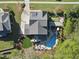 Aerial view showcasing backyard with in-ground pool, putting green, outdoor bar, and meticulously kept grounds at 3138 Curling Creek Dr, Apex, NC 27502