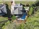 Aerial view showcasing a backyard with a pool, spa, putting green, and multiple seating areas for entertainment at 3138 Curling Creek Dr, Apex, NC 27502