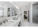 Spacious bathroom features a double vanity, marble floors, and patterned wallpaper at 3138 Curling Creek Dr, Apex, NC 27502