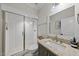 Bathroom featuring a glass enclosed shower with subway tiles and a vanity with granite counters at 3138 Curling Creek Dr, Apex, NC 27502