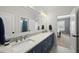 Elegant bathroom with double vanity, granite counters, and ample lighting at 3138 Curling Creek Dr, Apex, NC 27502