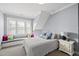 Bright bedroom featuring a window seat with decorative pillows at 3138 Curling Creek Dr, Apex, NC 27502