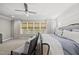 Comfortable bedroom with neutral tones, large windows, and stylish decor at 3138 Curling Creek Dr, Apex, NC 27502