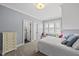 Comfortable bedroom featuring a bed with throw pillows and a window seat at 3138 Curling Creek Dr, Apex, NC 27502