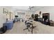 Spacious bonus room with a desk, drums, neutral walls and carpet, with a ceiling fan and natural light at 3138 Curling Creek Dr, Apex, NC 27502