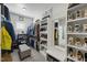 Well-organized walk-in closet featuring custom shelving and storage solutions at 3138 Curling Creek Dr, Apex, NC 27502