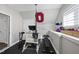 Home gym featuring workout equipment, motivational wall decor, and rubber flooring at 3138 Curling Creek Dr, Apex, NC 27502