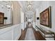 Elegant hallway features hardwood floors, modern lighting, console table, and stylish decor at 3138 Curling Creek Dr, Apex, NC 27502