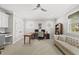 Spacious home office with desk, sofa, and natural light from two windows at 3138 Curling Creek Dr, Apex, NC 27502