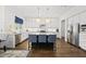 Spacious kitchen with a large island, stainless steel appliances, and ample cabinet space at 3138 Curling Creek Dr, Apex, NC 27502