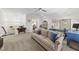 Spacious carpeted living area with sofa, desk, and access to other rooms in the home at 3138 Curling Creek Dr, Apex, NC 27502