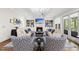 Bright living room with a fireplace, stylish furniture, and built-in shelving at 3138 Curling Creek Dr, Apex, NC 27502