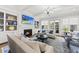 Bright living room with fireplace, built-ins, comfortable seating, and hardwood floors at 3138 Curling Creek Dr, Apex, NC 27502