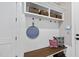Mudroom with coat rack, built in bench and overhead storage at 3138 Curling Creek Dr, Apex, NC 27502