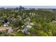 Aerial view showcases the property's location in a lush, wooded neighborhood near the city at 3312 Rock Creek Dr, Raleigh, NC 27609
