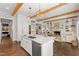 Open concept kitchen with a marble island, and view of the living room at 3312 Rock Creek Dr, Raleigh, NC 27609