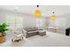 Bright living room with carpet, white walls, and a large window with shutters at 3312 Rock Creek Dr, Raleigh, NC 27609