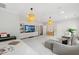 Spacious living room with carpet, light-colored walls, and pendant lights at 3312 Rock Creek Dr, Raleigh, NC 27609