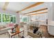Open concept living room with hardwood floors and view of the kitchen and dining area at 3312 Rock Creek Dr, Raleigh, NC 27609