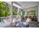 Inviting screened porch with comfortable seating and serene wooded views at 3312 Rock Creek Dr, Raleigh, NC 27609