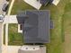 A bird's eye view of a house roof, surrounded by green grass and landscaped areas, gives perspective at 3529 Bailey Lake Dr, Fuquay Varina, NC 27526