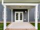 Covered back patio with double doors offers a seamless indoor-outdoor transition at 3529 Bailey Lake Dr, Fuquay Varina, NC 27526