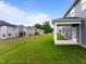Spacious backyard featuring a well-maintained lawn and a view of neighboring homes at 3529 Bailey Lake Dr, Fuquay Varina, NC 27526