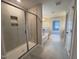 Bright bathroom featuring tile floors, a soaking tub, and a glass shower at 3529 Bailey Lake Dr, Fuquay Varina, NC 27526