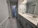 Bright bathroom featuring tile floors, double vanity with white countertops and gray cabinets at 3529 Bailey Lake Dr, Fuquay Varina, NC 27526