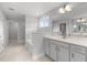 A well-lit bathroom boasts a soaking tub and vanity with granite countertops at 3529 Bailey Lake Dr, Fuquay Varina, NC 27526
