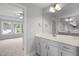 Bathroom vanity featuring an expansive mirror and plenty of natural light at 3529 Bailey Lake Dr, Fuquay Varina, NC 27526