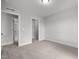 Well-lit bedroom with neutral carpet, en suite bathroom and closet at 3529 Bailey Lake Dr, Fuquay Varina, NC 27526