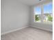 Cozy bedroom with carpet and large windows that offer a scenic view at 3529 Bailey Lake Dr, Fuquay Varina, NC 27526