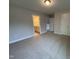 Spacious bedroom featuring neutral paint and plush carpet, with a bathroom through the doorway at 3529 Bailey Lake Dr, Fuquay Varina, NC 27526