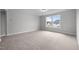 Large bonus room with carpet and two large window at 3529 Bailey Lake Dr, Fuquay Varina, NC 27526