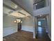 Elegant dining room featuring hardwood floors, detailed trim work, coffered ceiling, and a modern chandelier at 3529 Bailey Lake Dr, Fuquay Varina, NC 27526