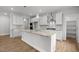 Stylish kitchen featuring granite countertops, stainless appliances, a center island, and sleek cabinetry at 3529 Bailey Lake Dr, Fuquay Varina, NC 27526