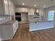 Well-equipped kitchen featuring stainless steel appliances, granite countertops, and a functional island at 3529 Bailey Lake Dr, Fuquay Varina, NC 27526