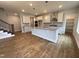 Well-equipped kitchen featuring stainless steel appliances, granite countertops, a functional island and pantry at 3529 Bailey Lake Dr, Fuquay Varina, NC 27526