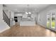 Open kitchen with stainless appliances, white cabinets, bar seating, and access to the backyard at 3529 Bailey Lake Dr, Fuquay Varina, NC 27526