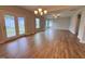 Spacious living room with hardwood floors, ample natural light, and an open floor plan at 3529 Bailey Lake Dr, Fuquay Varina, NC 27526